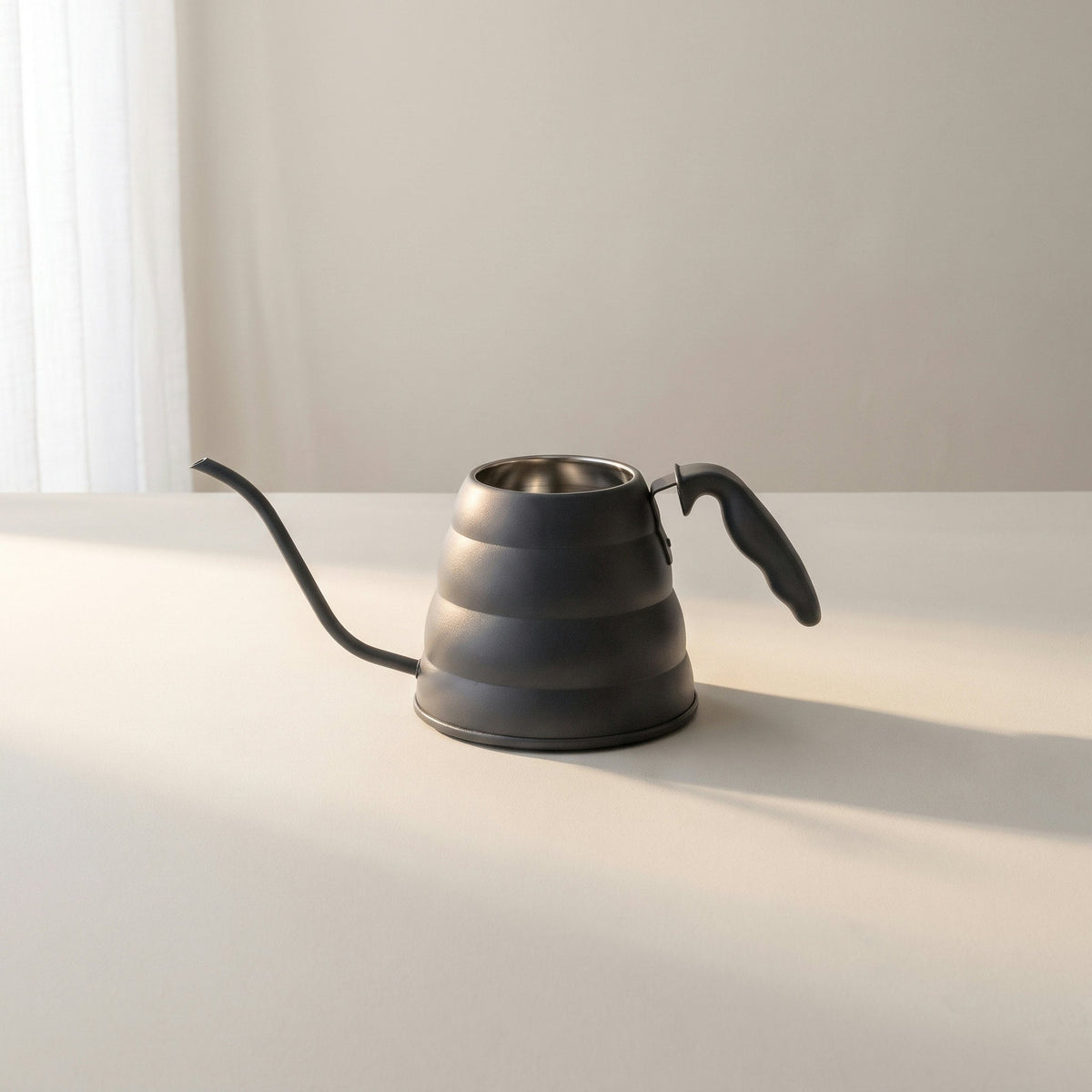 Watering can with the gooseneck spout, front view