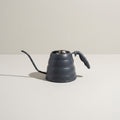 Kensington London slate grey watering can with gooseneck spout on pale limestone