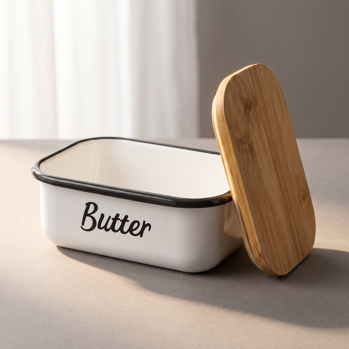 Butter dish with the bamboo lid leaning against it