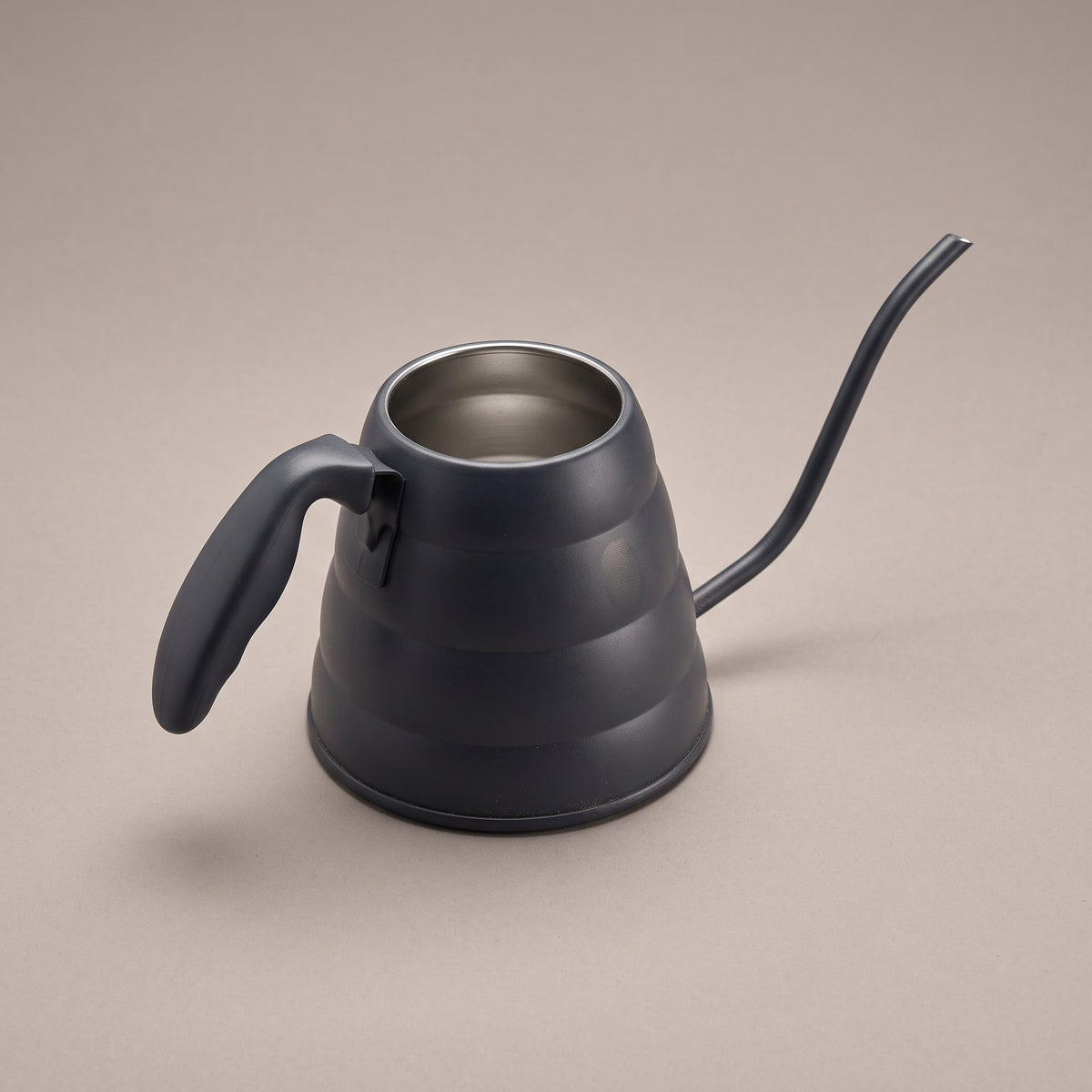 Watering can, studio three-quarter view