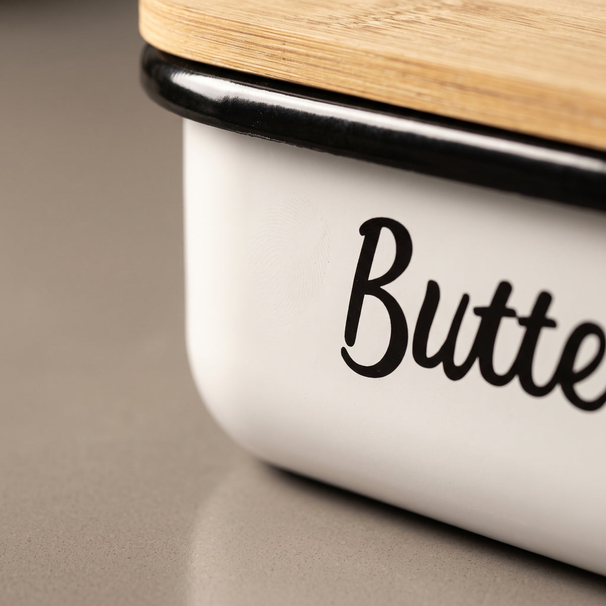 Macro of the enamel corner and rolled rim on the butter dish